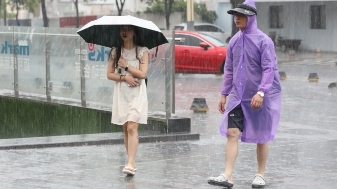 Typhoon Podul weakens but leaves alerts of heavy rainfall across Guangdong