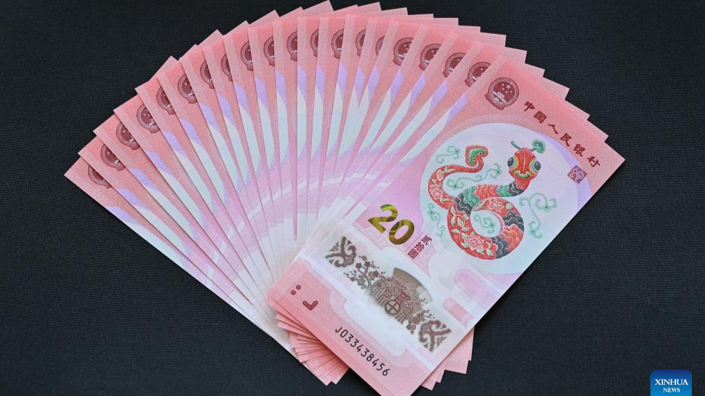 Commemorative coins, banknotes to celebrate upcoming Chinese New Year start to exchange