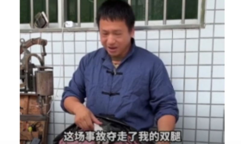Screenshot of a video from The Paper that Huang Huaquan, a legless cobbler from Heyuan, south China's Guangdong Province, shares his life story in fluent English.