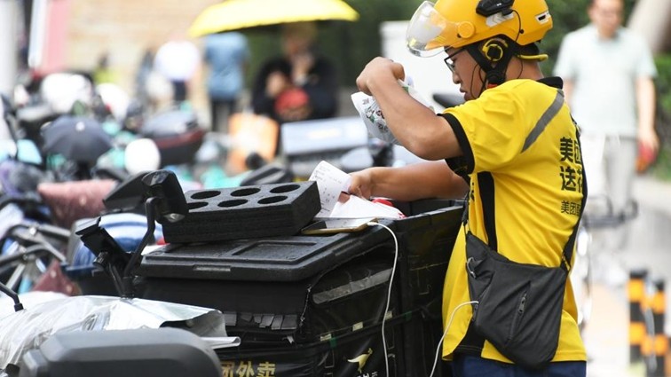 China's market watchdog summons three food delivery platforms for regulated development