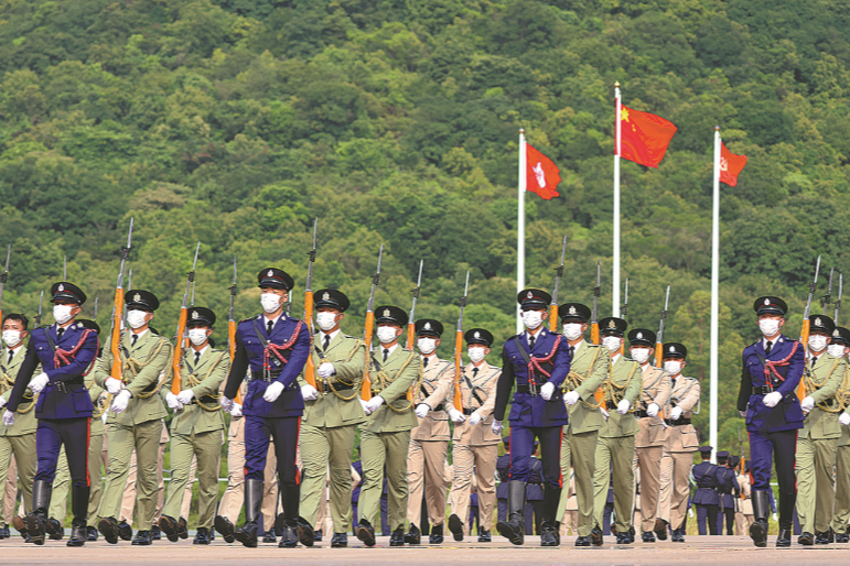 Parade by disciplined services hails national day in HK