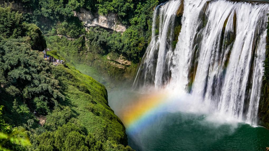 Tourists visit Huangguoshu waterfall scenic area in Anshun, SW China