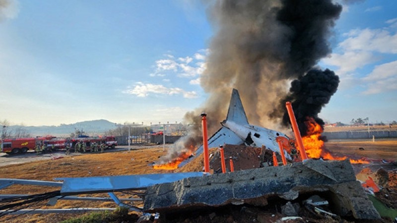 Airplane skids off runway in South Korea, killing all 179 people except 2 rescued; a bird strike and adverse weather likely the cause: local fire chief