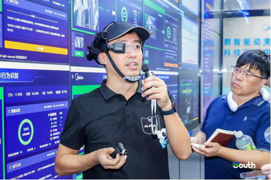 Midea staff showcasing AI-assisted glasses