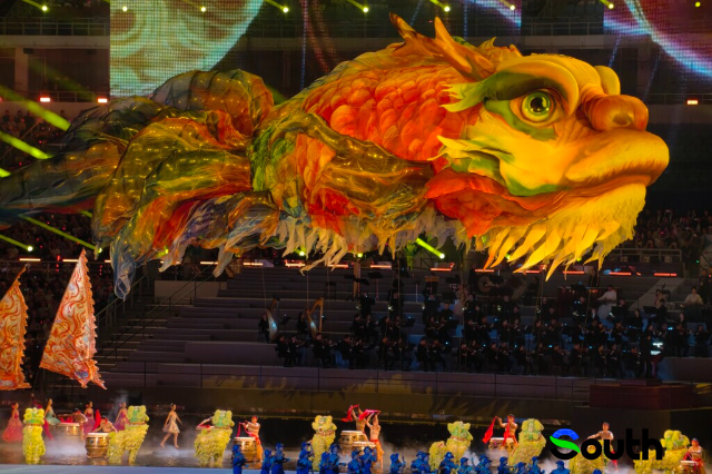 Giant Ao Fish in air and dancing lions on stage at 15th National Games opening ceremony
