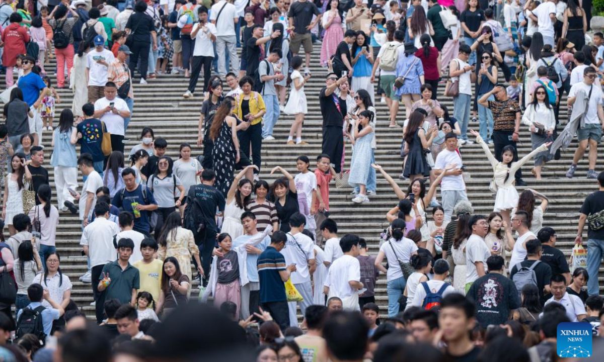 Tourists are pictured near the Ruins of St. Paul's in south China's Macao, May 3, 2025. The first three days of China's May Day holiday saw a significant influx of visitors to the Macao Special Administrative Region (SAR), injecting new vitality into the local tourism industry.

Statistics from the SAR's Public Security Police Force (CPSP) showed that from Thursday to Saturday, Macao's border checkpoints recorded entries and exits of 731,474, 837,062, and 826,273, respectively. Friday experienced the highest daily total, including 221,968 incoming visitors, marking the highest single-day record for inbound tourists since the pandemic.(Xinhua/Cheong Kam Ka)
