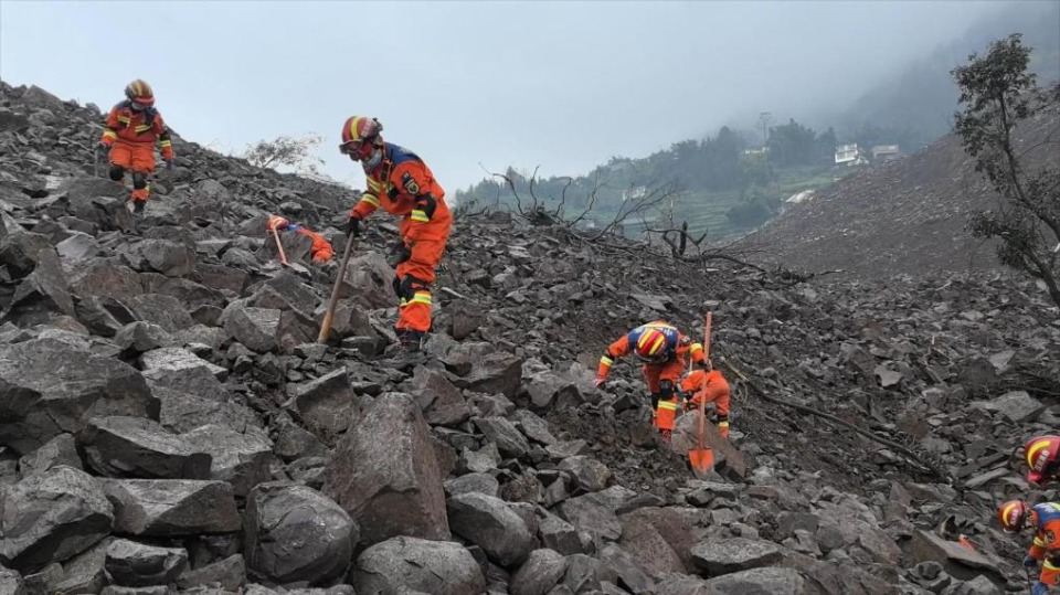 Rescuers race against time to find survivors after deadly landslide in SW China