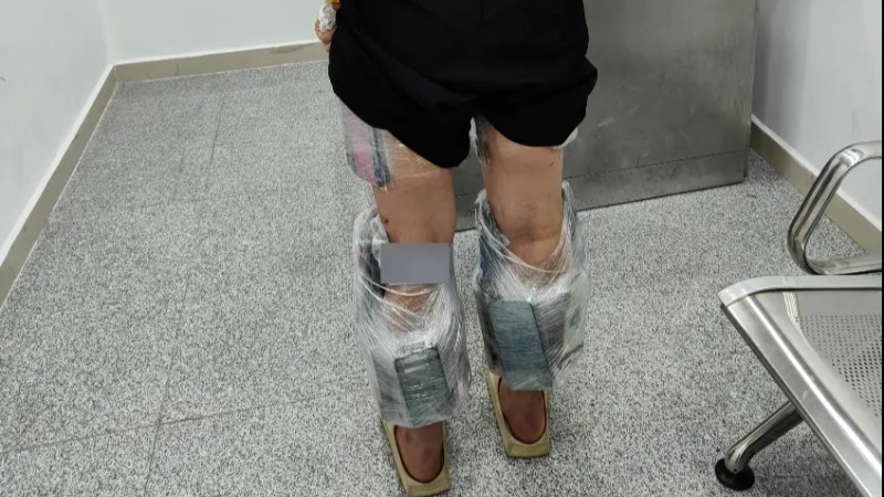 Woman with 74 mobile phones strapped to her legs seized by customs officers