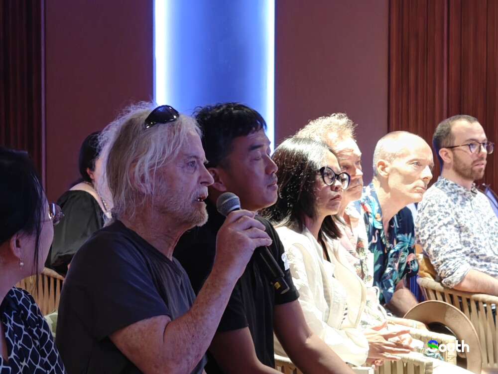 Audience posed question to speakers.