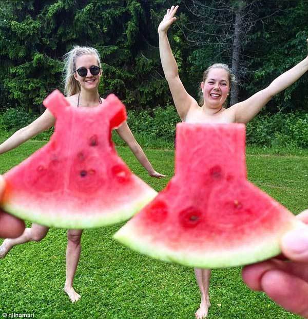 Juicy couture! #watermelon dress craze sweeps social media as selfie fans pose in front of tiny outfits carved from tropical fruit