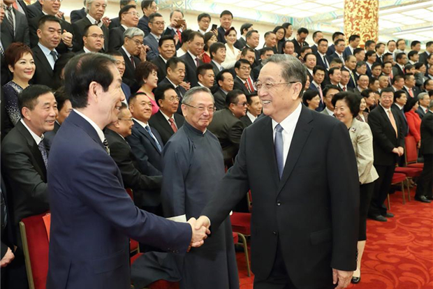 Top political advisor stresses uniting overseas Chinese