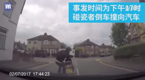 Bizarre moment a biker pushes his moped into a car before leaping onto the windscreen 'in a cash for crash attempt'