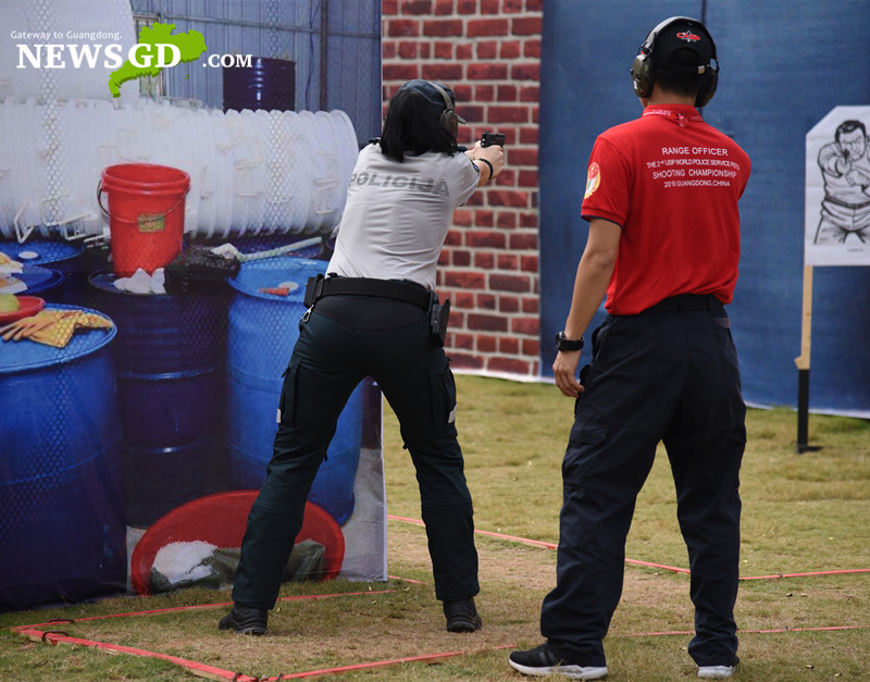 Player from Lietuva shooting the target in the simulated drug producing site. (Photo: Steven Yuen)