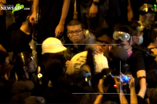 Internal strife broke out among Hong Kong demonstrators during an illegal gathering