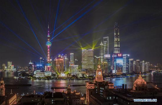 Aerial photo taken on Sept. 26, 2019 shows a light show at Lujiazui area in Pudong District of east China's Shanghai. (Xinhua/Ren Long)