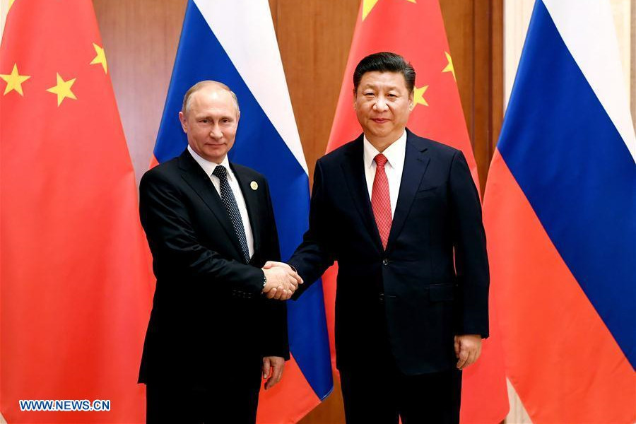Xi says China, Russia play role of "ballast stone" in world peace, stability