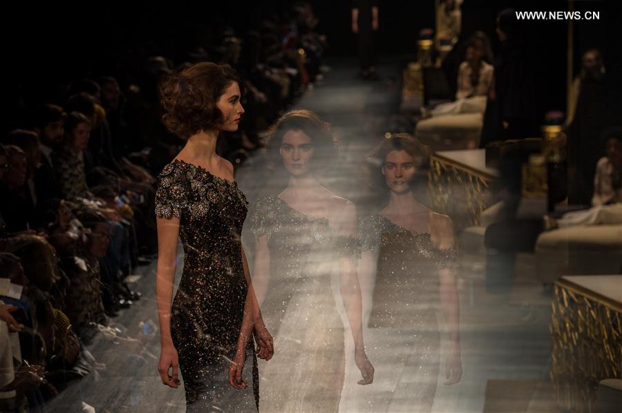 The multiple exposure photo taken on Feb. 14, 2017 shows a model presenting a creation of Badgley Mischka during the 2017 New York Fashion Week in New York City, the United States.