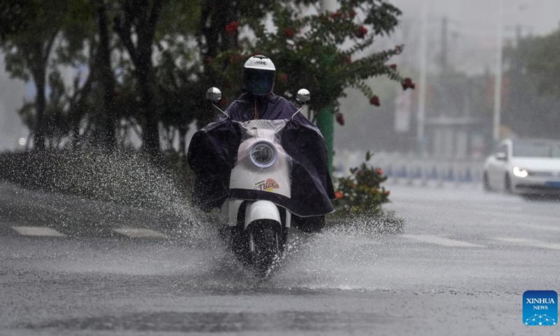 A citizen rides amid heavy rainfall in Beihai City, south China's Guangxi Zhuang Autonomous Region, June 14, 2025. Multiple Chinese authorities convened on Saturday to put in place precautionary measures against Typhoon Wutip, the first typhoon of the year, which is expected to bring heavy rainfall to the southern parts of the country. (Photo: Xinhua)