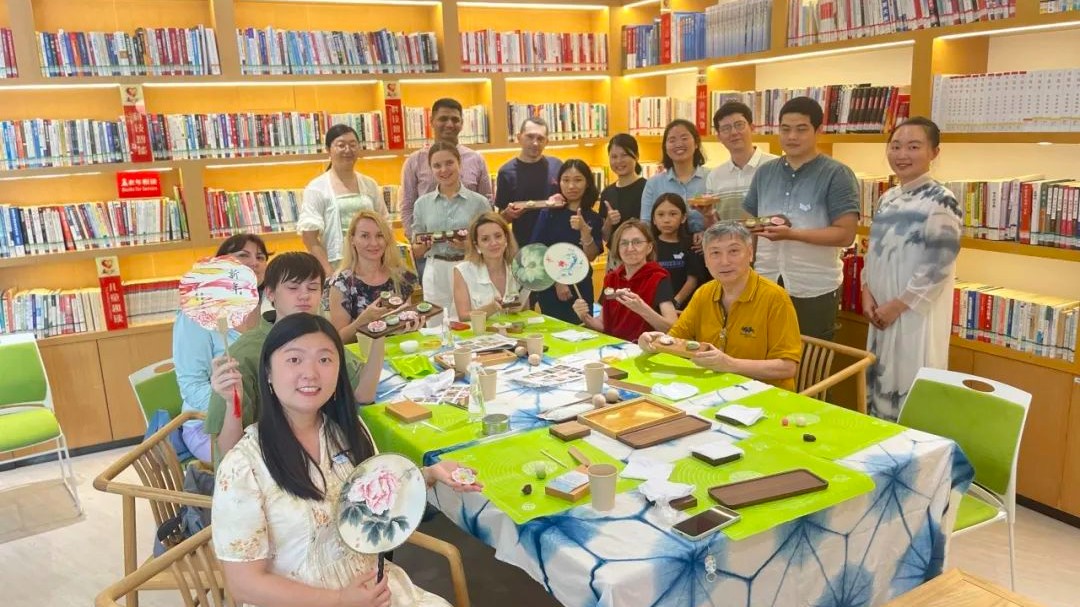 International volunteers bring Song Dynasty-style tea pastries to life, fostering community co-governance in Guangzhou's Nansha