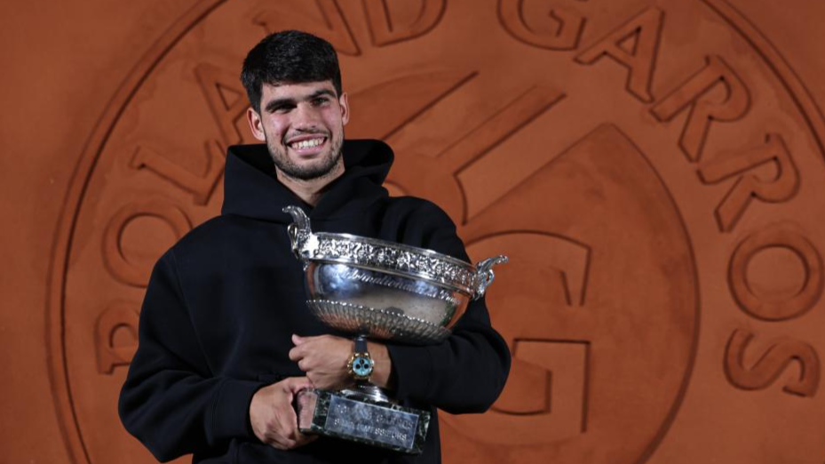 Alcaraz rallies to beat Sinner in five sets to retain French Open title