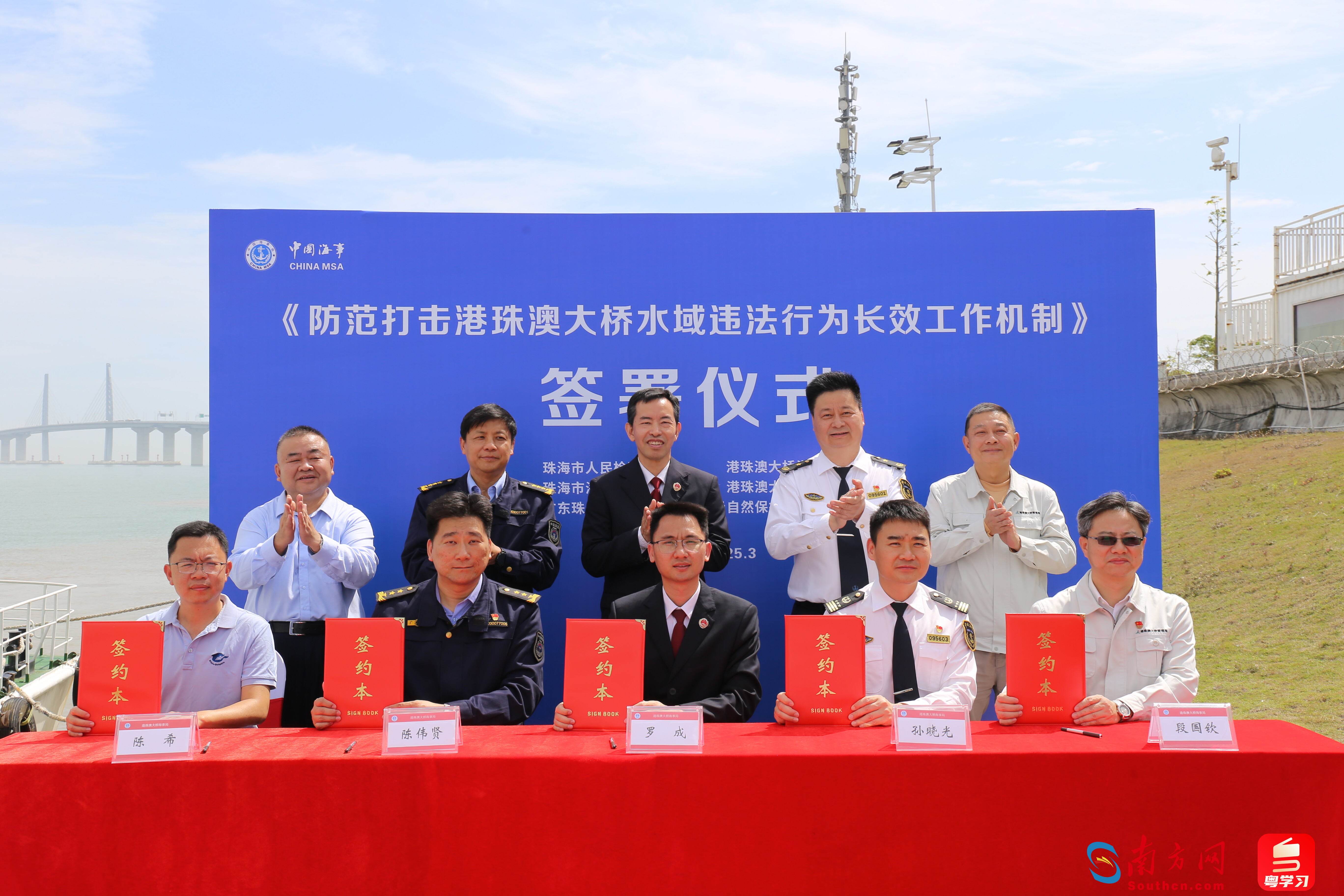  五部门正式签署工作机制文件。林高燕摄。