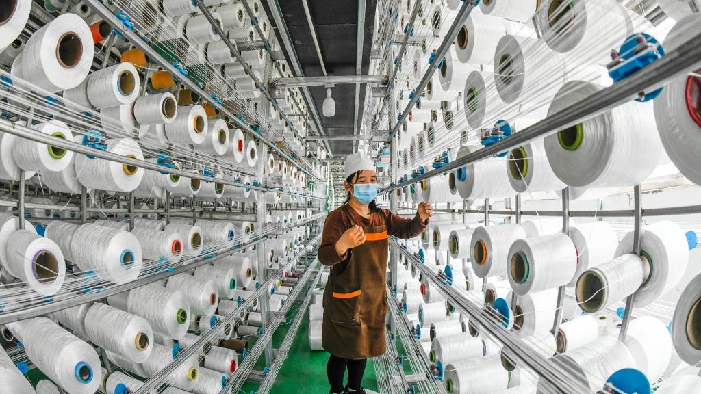 China's textile industry tiding through challenges with reforms