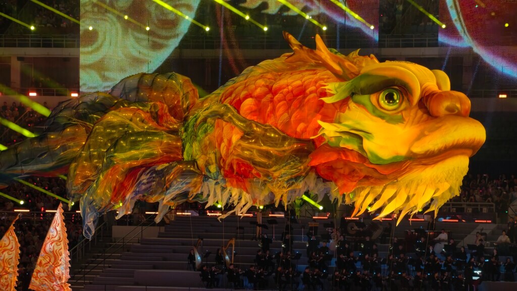 Giant Ao Fish in air and dancing lions on stage at 15th National Games opening ceremony