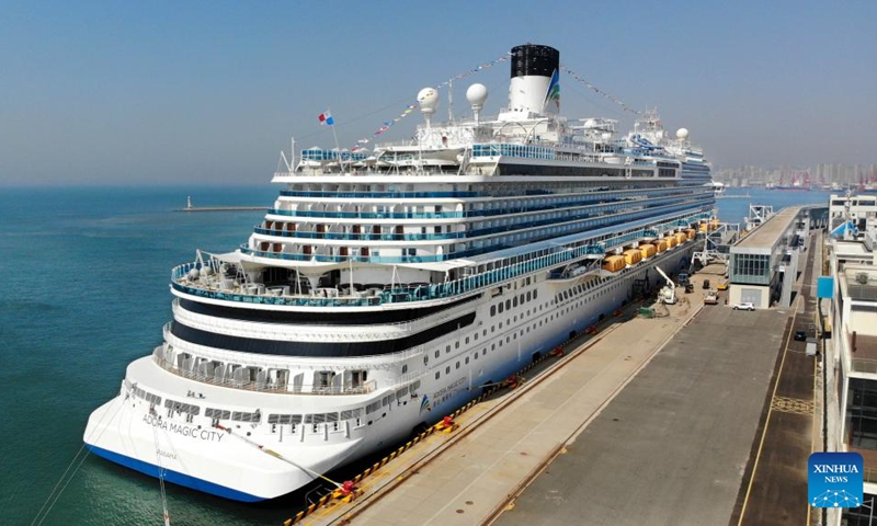 An aerial drone photo taken on April 6, 2025 shows Adora Magic City berthing at the Qingdao International Cruise Terminal in Qingdao, east China's Shandong Province. As China's first domestically built large cruise ship, Adora Magic City embarked on its commercial maiden voyage on Jan. 1, 2024. This time, the cruise ship made its debut in Qingdao, which is its first appearance in a Chinese port city other than its home port in Shanghai, and will depart for Jeju of South Korea and Fukuoka of Japan. (Xinhua/Li Ziheng)
