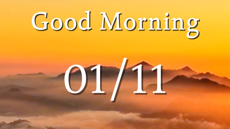 Golden sunlight bathes mountains above a swelling sea of clouds