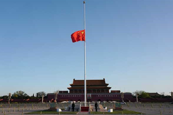 Chinese national flag flies at half-mast to mourn for people died in COVID-19 fight