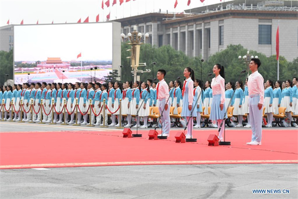 Chinese Communist Youth League members, Young Pioneers salute CPC