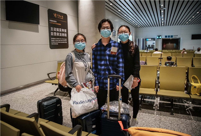 Hundreds more students return home to China