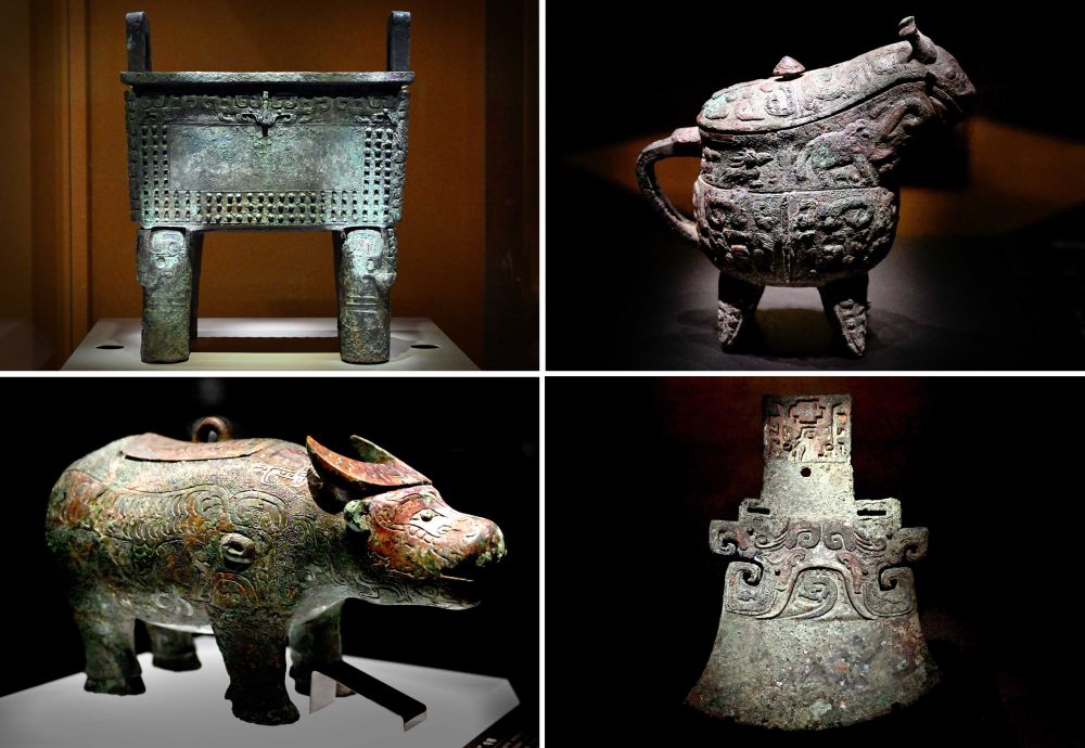 殷墟博物馆新馆内展出的“司母辛”铜鼎（左上）、“亚长”铜觥（右上）、“亚长”牛尊（左下）、“亚长”铜钺（拼版照片，2月23日摄）。