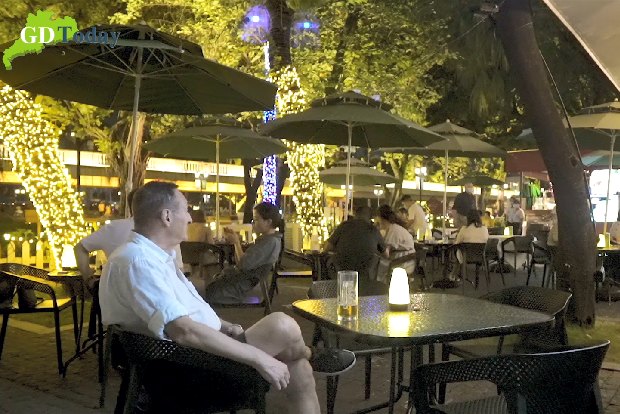 What is the best way to explore the new charm and nightlife of Guangzhou?